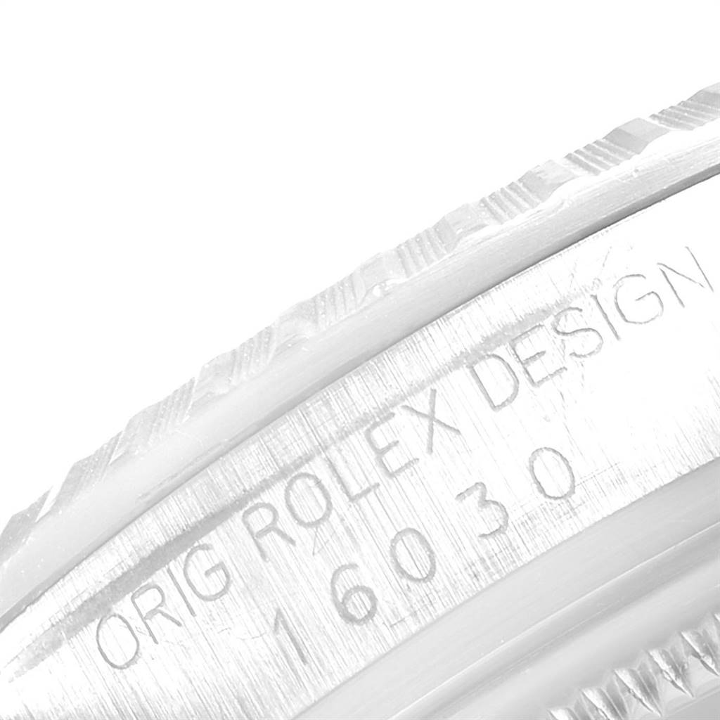 This close-up angle shows the engraved bezel of a Rolex Vintage Collection 16030 Men's Stainless Steel Silver Dial 16030 Men's Stainless Steel Silver Dial watch.
