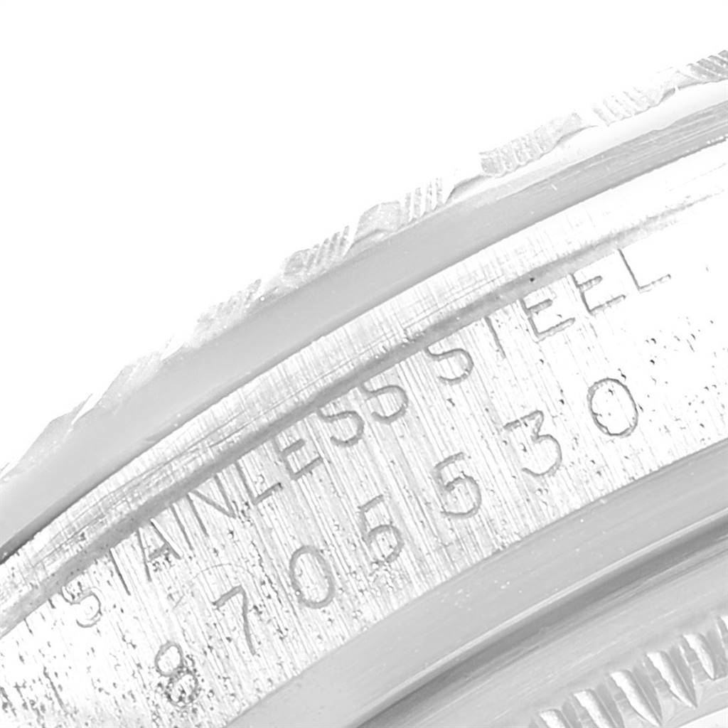 This image shows a close-up of the stainless steel caseback and serial number engraving of a Vintage Collection model by Rolex.