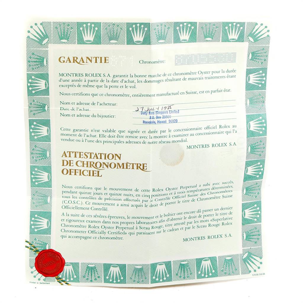 The image shows a close-up of a certificate of guarantee and official chronometer certification for a Vintage Collection Rolex watch.