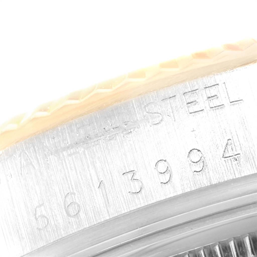 This close-up image shows the serial number and part of the bezel and case of the Rolex Vintage Collection 16013 Men's Stainless Steel Black Dial 16013 Men's Stainless Steel Black Dial watch.