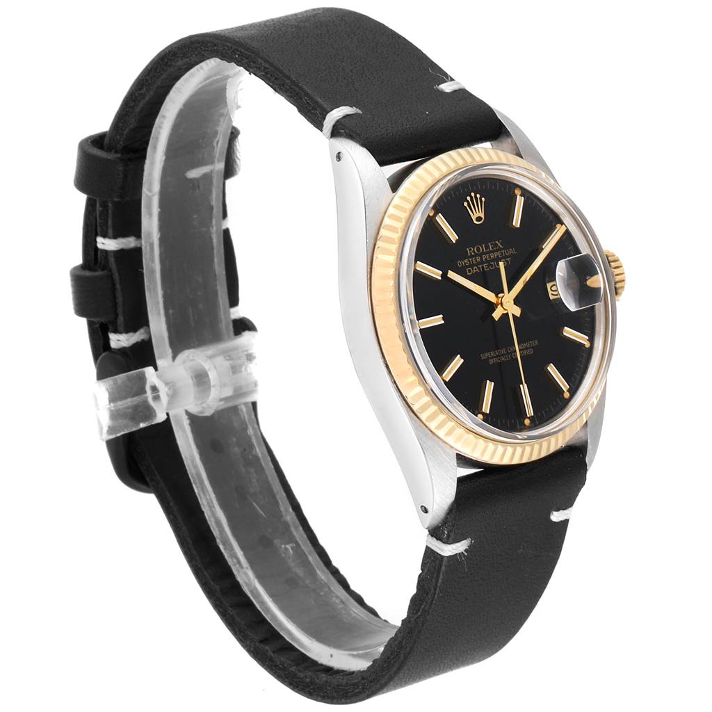 This image shows a side angle of a Rolex Vintage Collection 16013 Men
s Stainless Steel Black Dial 16013 Men
s Stainless Steel Black Dial watch, detailing the black dial, gold bezel, and black leather strap.
