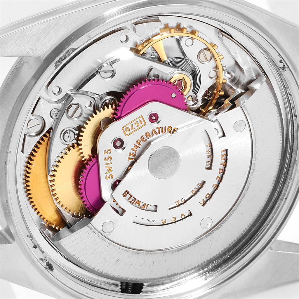 This image shows the intricate movement and internal mechanisms of a Rolex Vintage Collection 1601 Men's Steel and Gold (two tone) White Dial 1601 Men's Steel and Gold (two tone) White Dial watch from a rear angle.