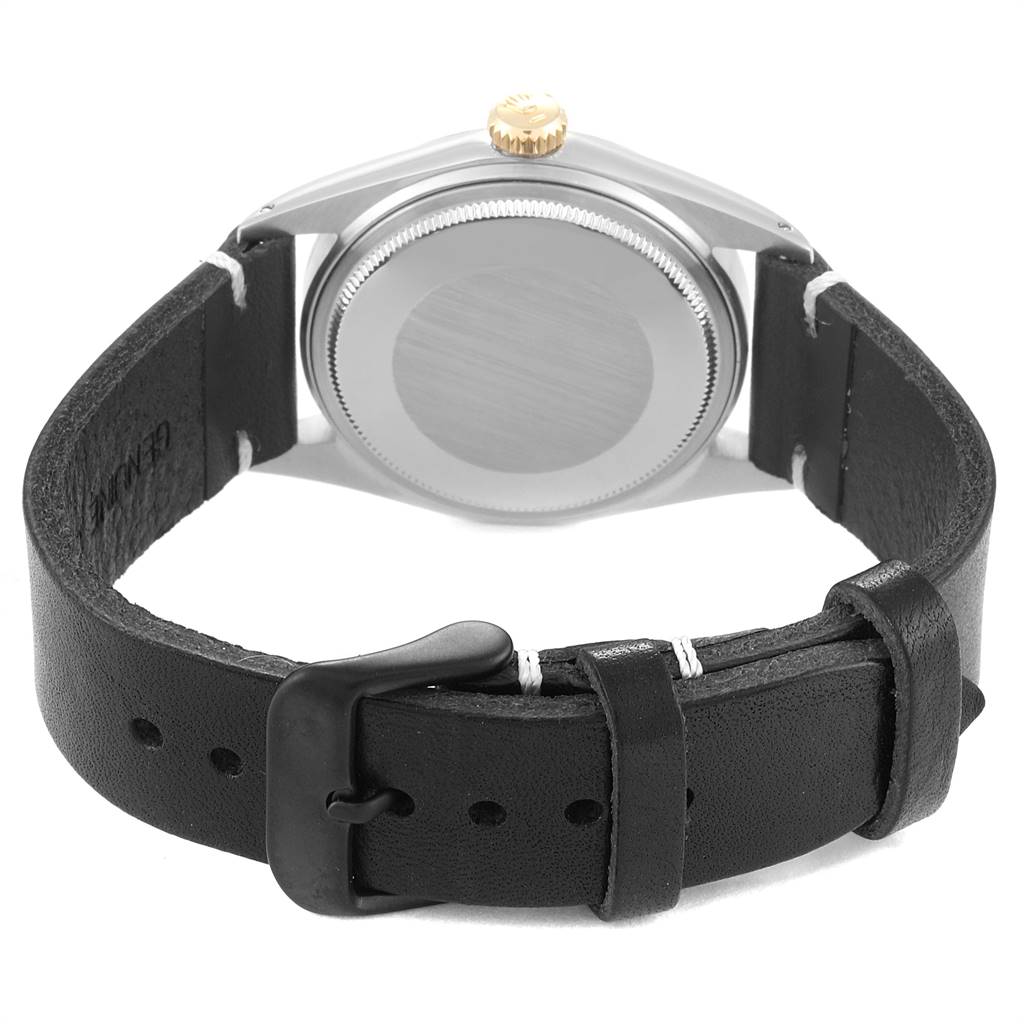 The image shows the back view of a Rolex Vintage Collection 1601 Men's Steel and Gold (two tone) White Dial 1601 Men's Steel and Gold (two tone) White Dial watch, displaying its case back, crown, and leather strap with a buckle.