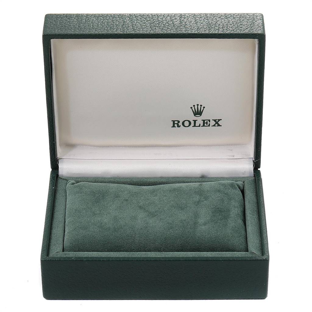 The image shows an open Rolex box for the Vintage Collection model, displaying the green cushioned interior and the logo on the lid.