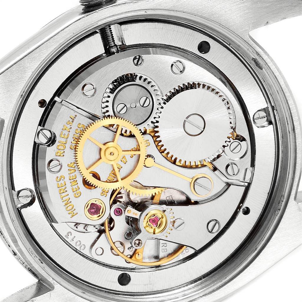 This image shows an open back view of the Rolex Vintage Collection 6694 Men
s Stainless Steel Silver Dial 6694 Men
s Stainless Steel Silver Dial watch, revealing its intricate internal gears and mechanism.