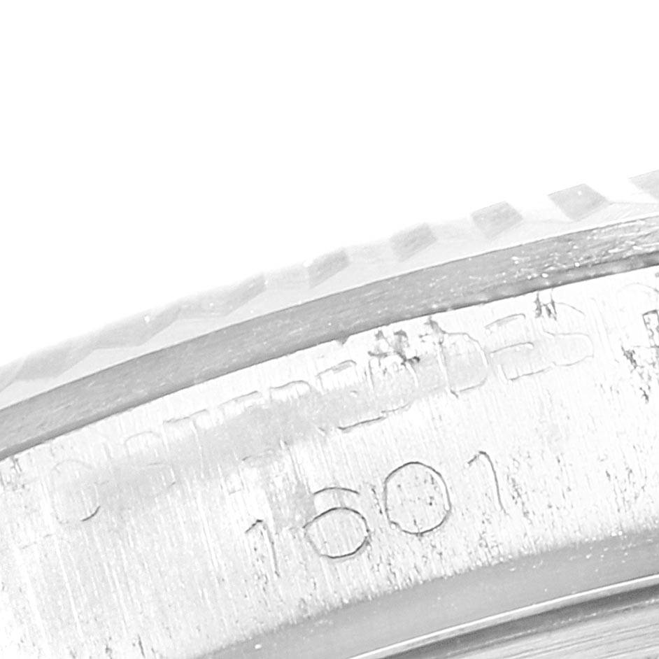This close-up angle shows the engraved serial number "1601" on the case of a Vintage Collection Rolex watch.