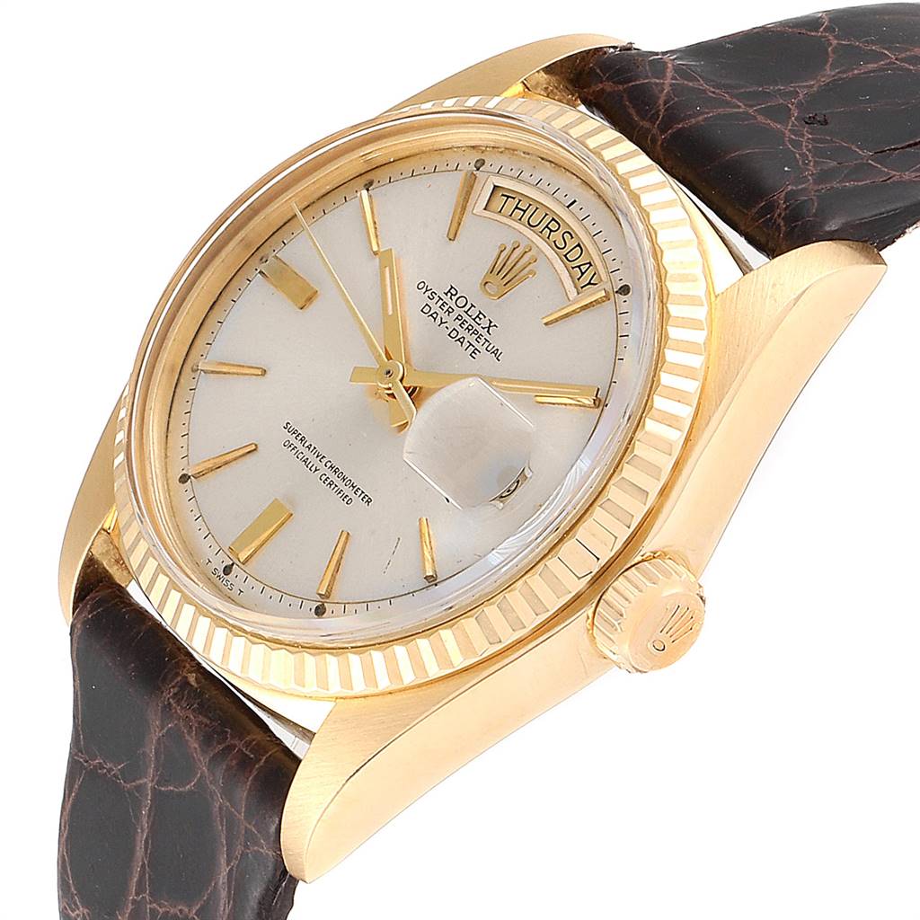 This Vintage Collection Rolex watch is shown at a slight top angle, highlighting its face, crown, and leather strap.