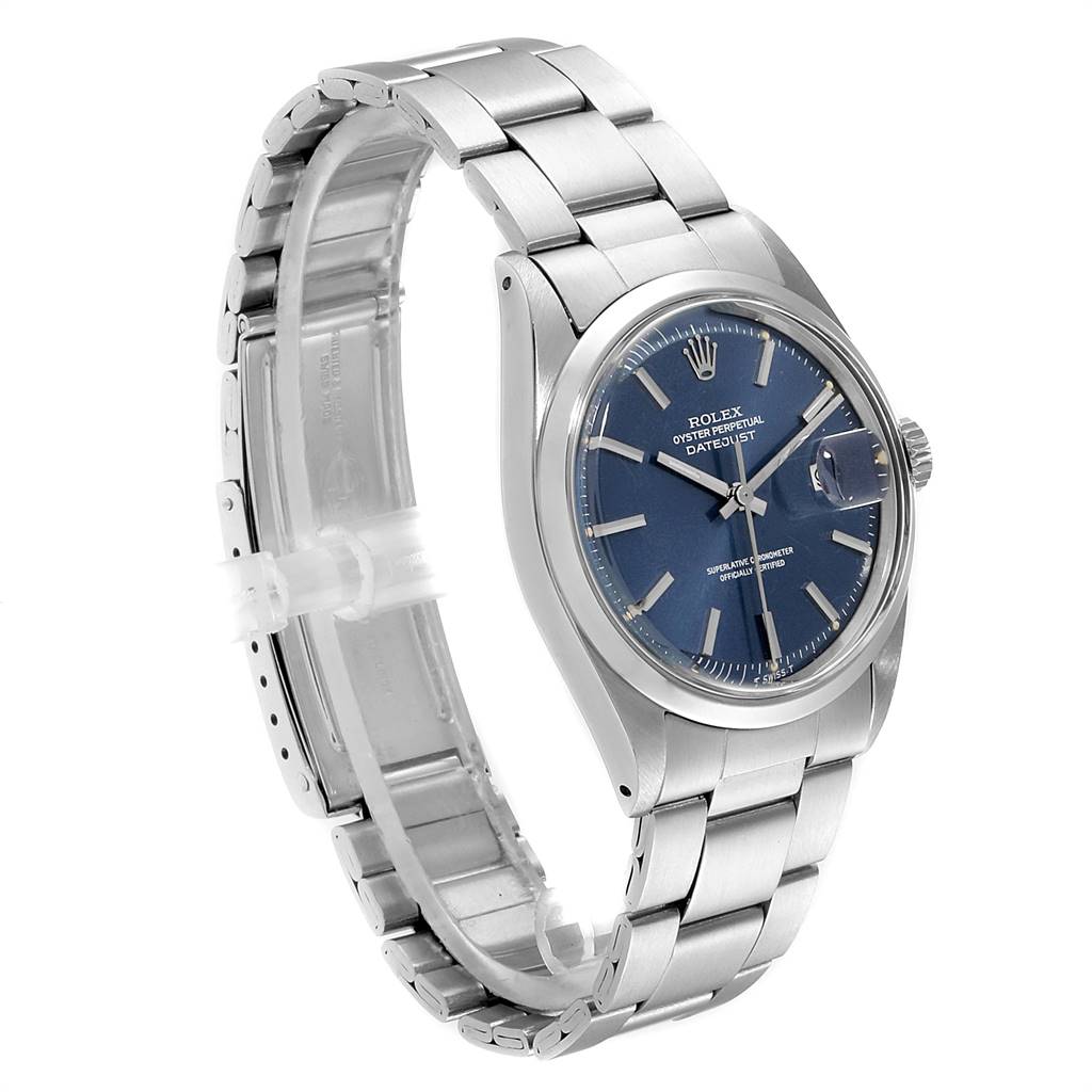 This Vintage Collection Rolex watch is shown at a slight side angle, displaying its blue dial, bezel, case, and stainless steel bracelet.