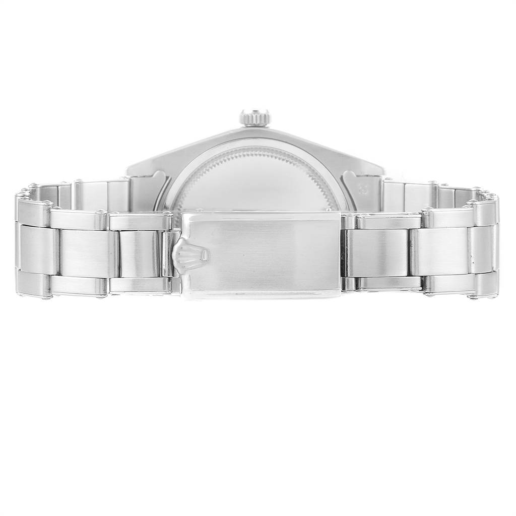 The image shows the back and bracelet clasp of a Vintage Collection model by Rolex.