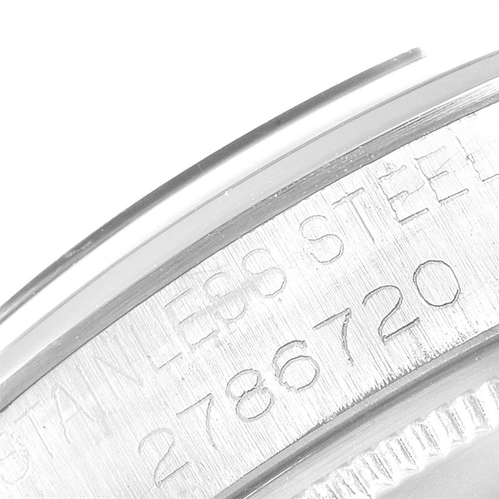 This close-up image shows the serial number on the case back edge of a Vintage Collection Rolex.