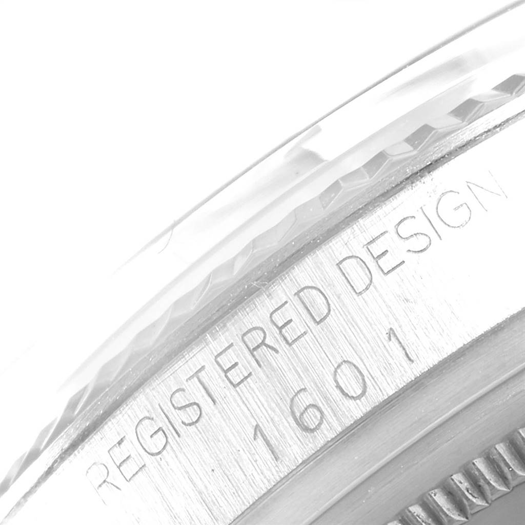 This close-up image shows the side of the case of the Rolex Vintage Collection 1601 Men
s Stainless Steel Silver Dial 1601 Men
s Stainless Steel Silver Dial model, displaying the engraved design and model number.