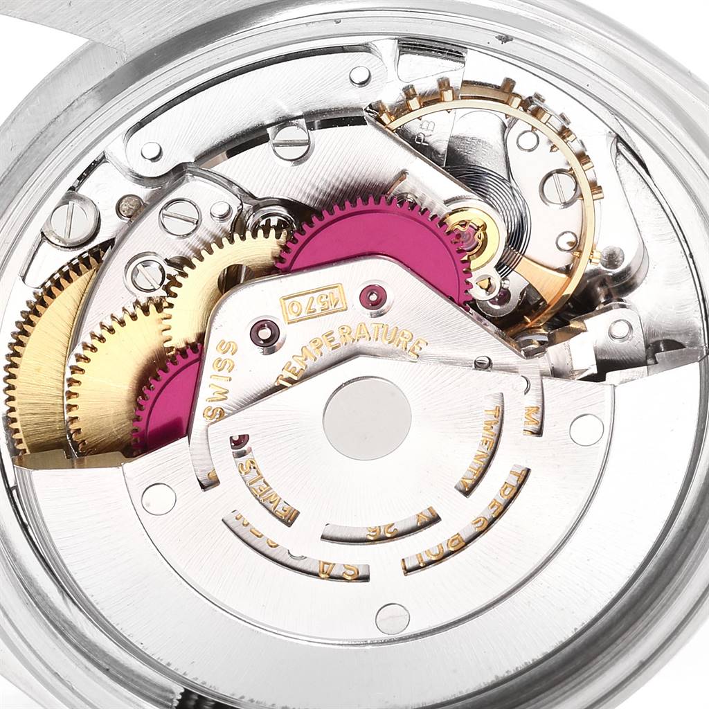 This image shows a close-up view of the intricate internal mechanism of a Vintage Collection Rolex watch.
