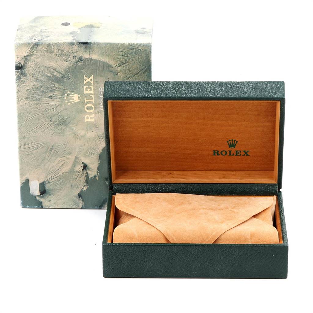 The image shows the packaging and outer box for a Vintage Collection model by Rolex, including a green Rolex branded box and an envelope.