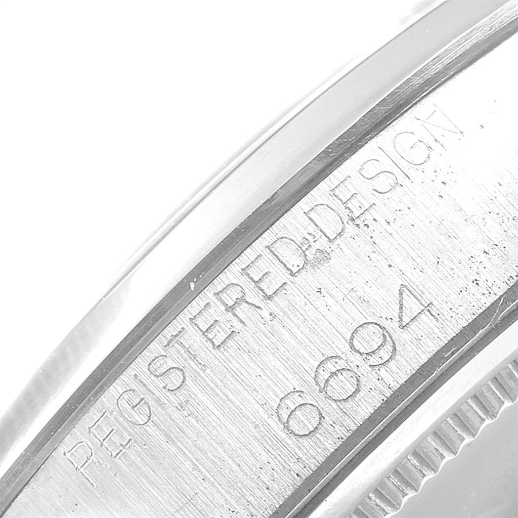 This close-up image shows the engraved outer edge of the Rolex Vintage Collection 6694 Men
s Stainless Steel Silver Dial 6694 Men
s Stainless Steel Silver Dial model, highlighting its model number and design details.