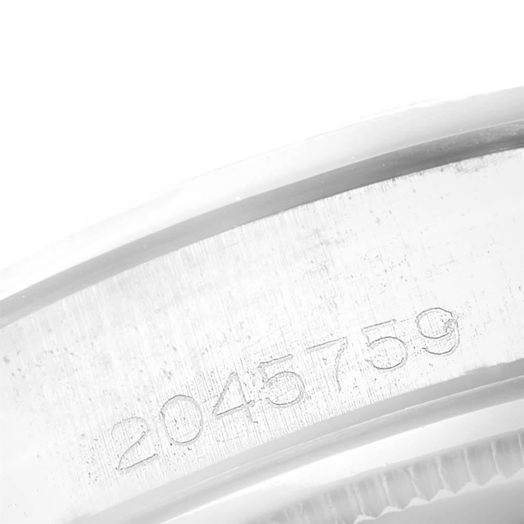 This image shows a close-up of the serial number on the case of a Rolex Vintage Collection 6694 Men
s Stainless Steel Silver Dial 6694 Men
s Stainless Steel Silver Dial model watch.