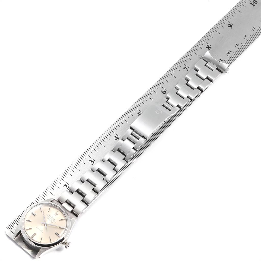 The image shows a flat lay of the Rolex Vintage Collection 5500 Men's Stainless Steel Silver Dial 5500 Men's Stainless Steel Silver Dial watch, including the face and stainless steel bracelet, measured against a ruler.