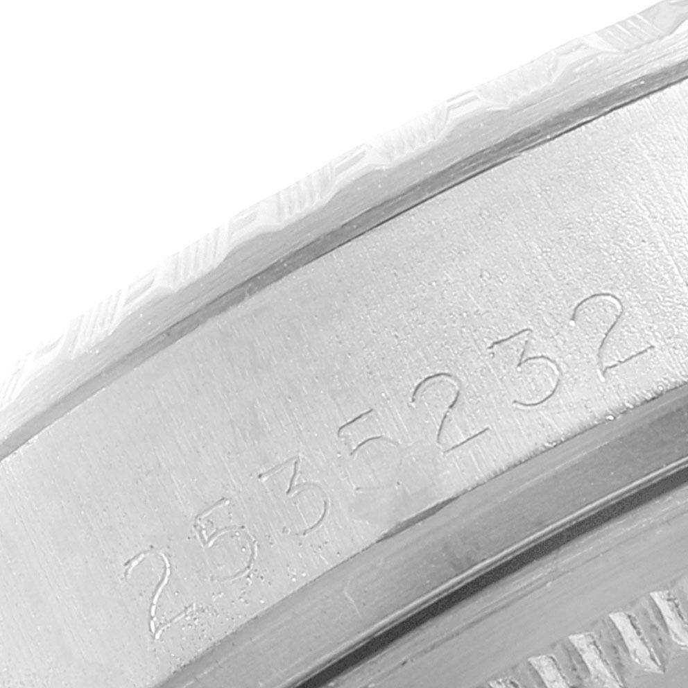 The image shows a close-up of the serial number engraved on the case of a Vintage Collection Rolex watch.