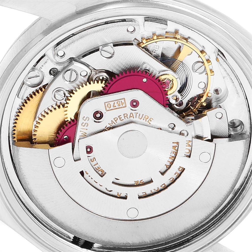 The image shows the intricate inner mechanism and gears of the Rolex Vintage Collection 1603 Men
s Stainless Steel Silver Dial 1603 Men
s Stainless Steel Silver Dial model watch, viewed from the back.