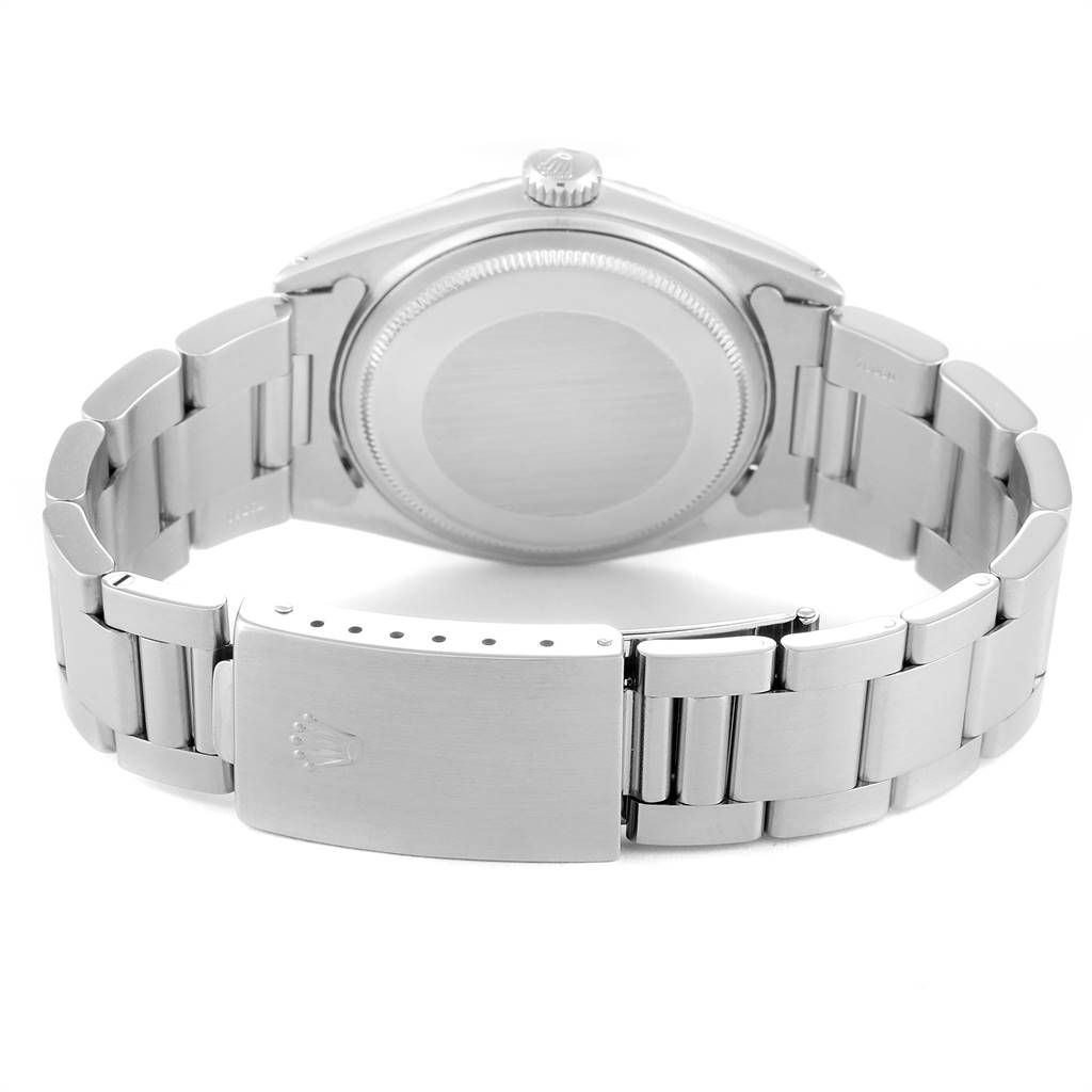 This image shows the back view of a Rolex Vintage Collection 1603 Men
s Stainless Steel Silver Dial 1603 Men
s Stainless Steel Silver Dial watch, highlighting the clasp, bracelet, case back, and crown.