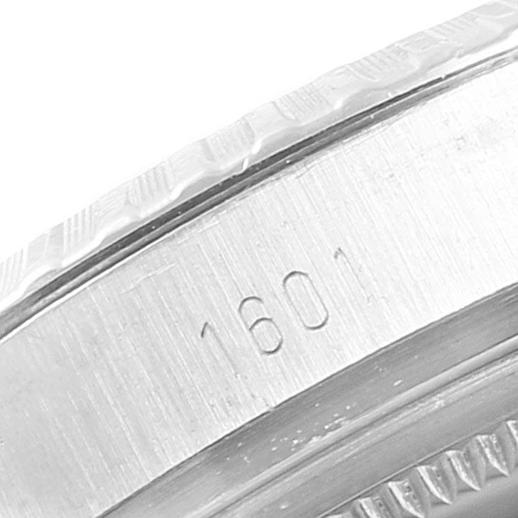This image shows a macro shot of the casing with the model number "1601" on the Rolex Vintage Collection 1601 Men
s Stainless Steel Silver Dial 1601 Men
s Stainless Steel Silver Dial watch.