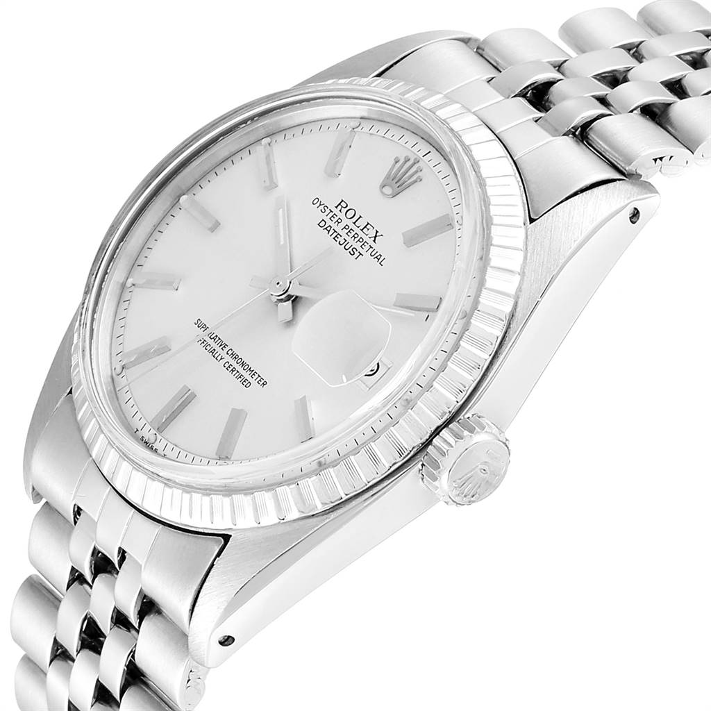This image shows a side angle of a Vintage Collection Rolex watch, including its white dial, fluted bezel, and Jubilee bracelet.