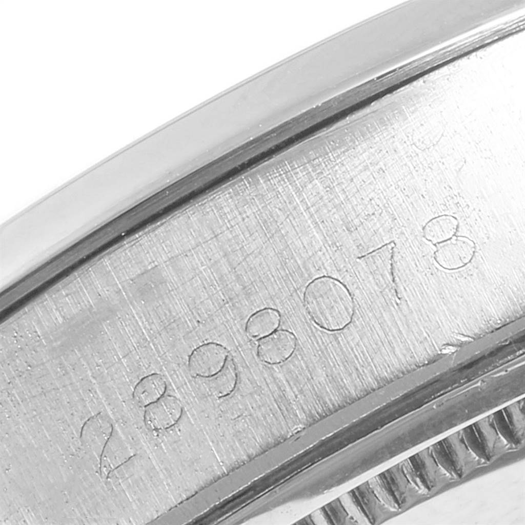 The image shows a close-up view of the serial number engraved on the side of the case of a Rolex Vintage Collection 6694 Men's Stainless Steel Grey Dial 6694 Men's Stainless Steel Grey Dial watch.