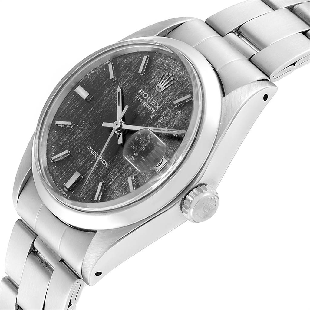The image shows a side view of the Rolex Vintage Collection 6694 Men's Stainless Steel Grey Dial 6694 Men's Stainless Steel Grey Dial watch, featuring the face, bezel, crown, and part of the bracelet.