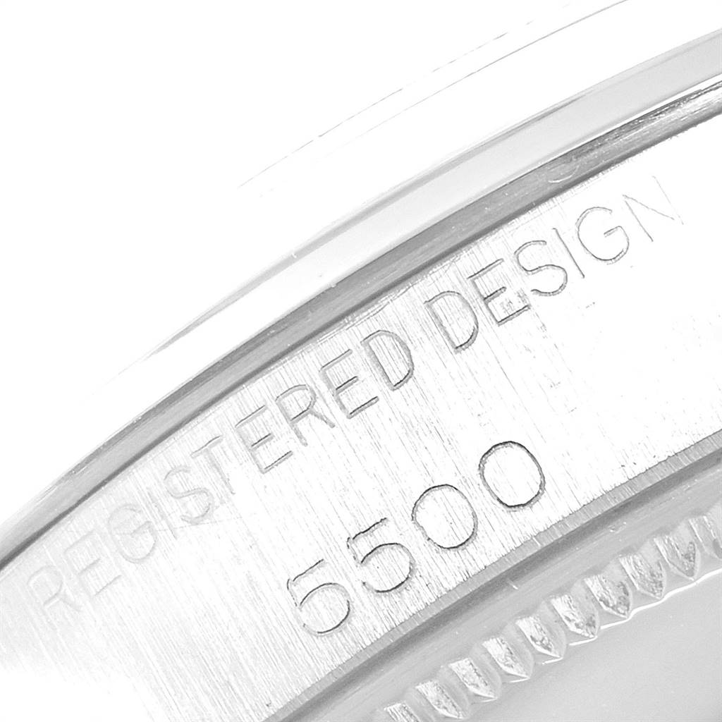 This image shows a close-up view of the Rolex Vintage Collection 5500 Men
s Stainless Steel Silver Dial 5500 Men
s Stainless Steel Silver Dial model, focusing on the "Registered Design 6500" inscription.