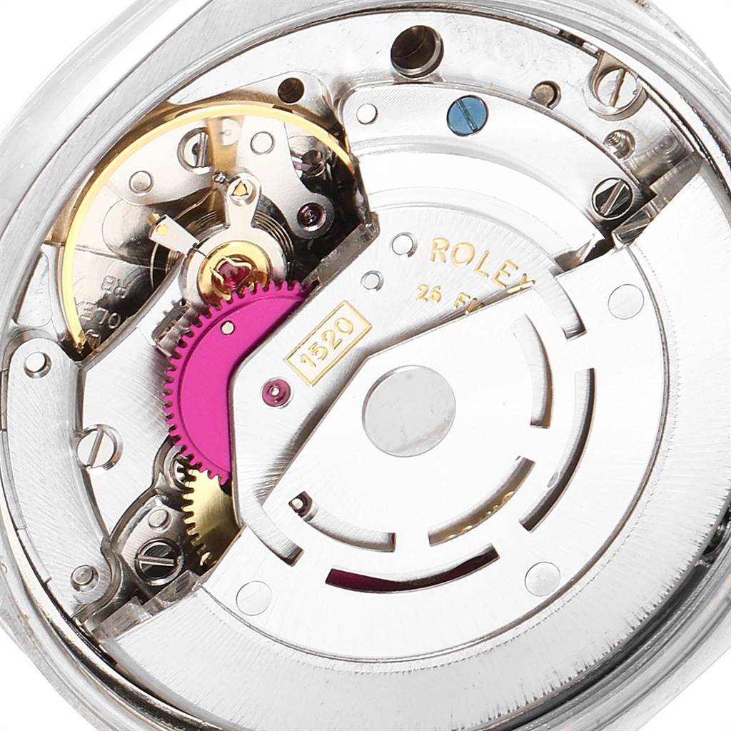 This image shows a close-up view of the internal mechanism, or movement, of the Vintage Collection Rolex watch.