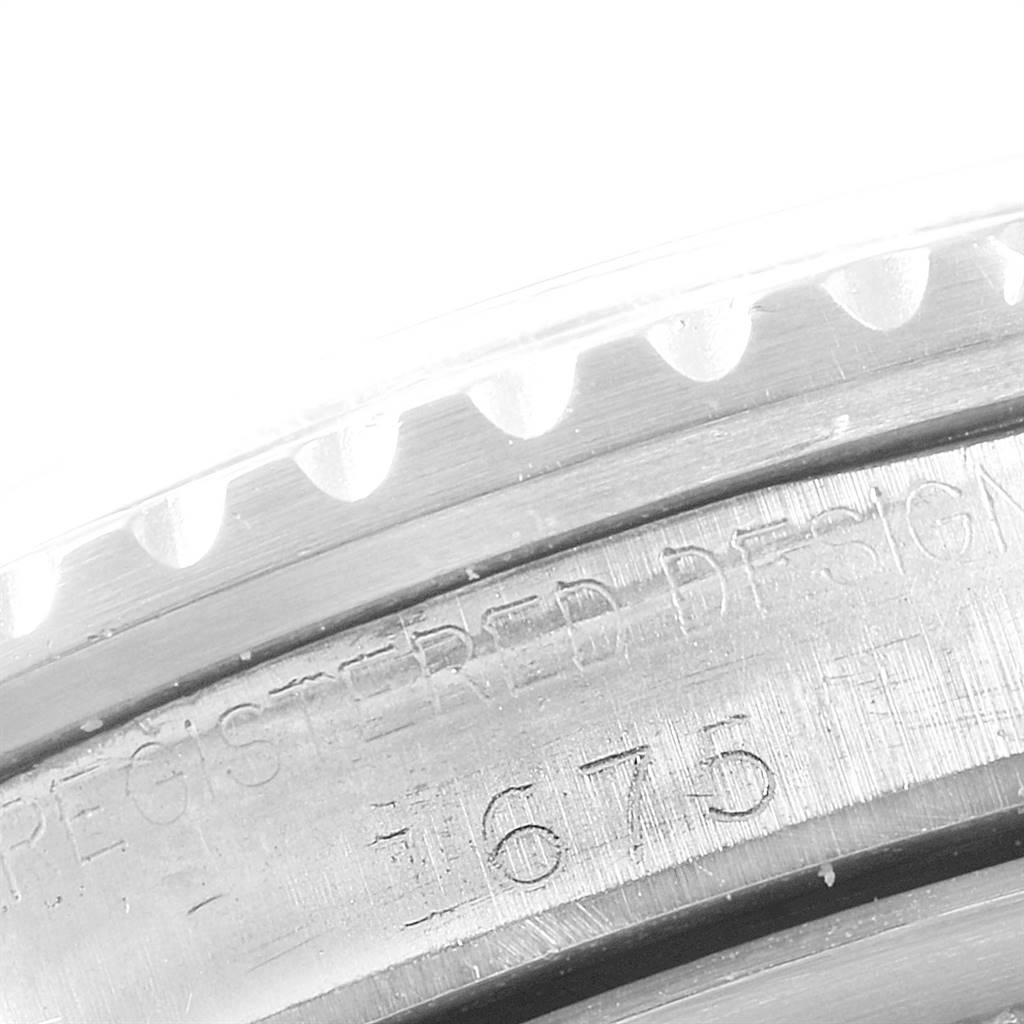 The image shows a close-up view of the bezel and serial number engraving on a Rolex Vintage Collection 1675 Men
s Stainless Steel Black Dial 1675 Men
s Stainless Steel Black Dial model.