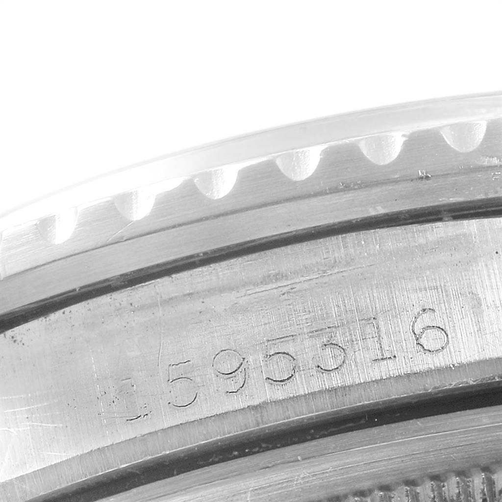The image shows a close-up of the engraved serial number on the case back of a Vintage Collection model by Rolex.