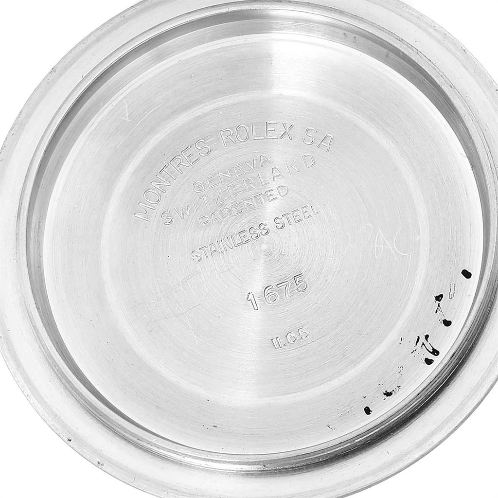 This image shows the inside case back of a Vintage Collection model by Rolex, stamped with various details and numbers.