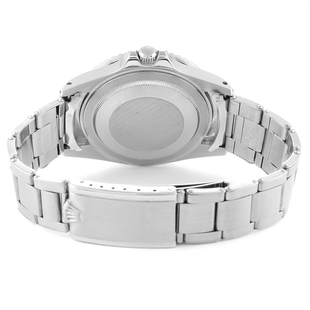 The image shows the back case and metal bracelet clasp of a Rolex Vintage Collection 1675 Men
s Stainless Steel Black Dial 1675 Men
s Stainless Steel Black Dial watch.