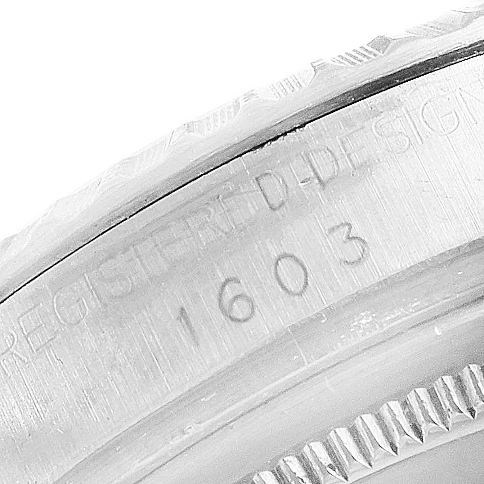 The close-up image shows the engraved details on the case of a Rolex Vintage Collection 1603 Men
s Stainless Steel Brown Dial 1603 Men
s Stainless Steel Brown Dial model 1603.