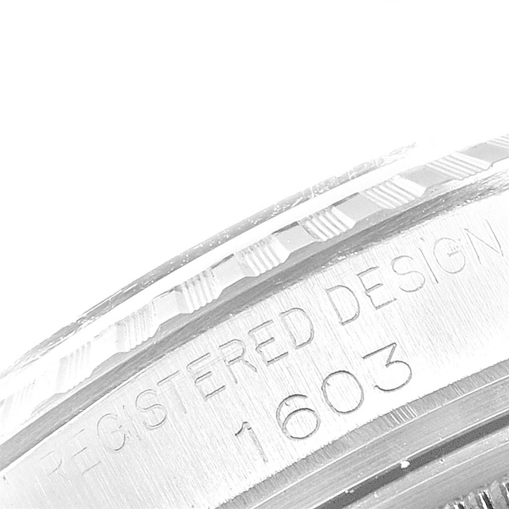 This image shows a close-up of the engraved edge of a Rolex Vintage Collection 1603 Men
s Stainless Steel Silver Dial 1603 Men
s Stainless Steel Silver Dial model, highlighting the design number 1603.