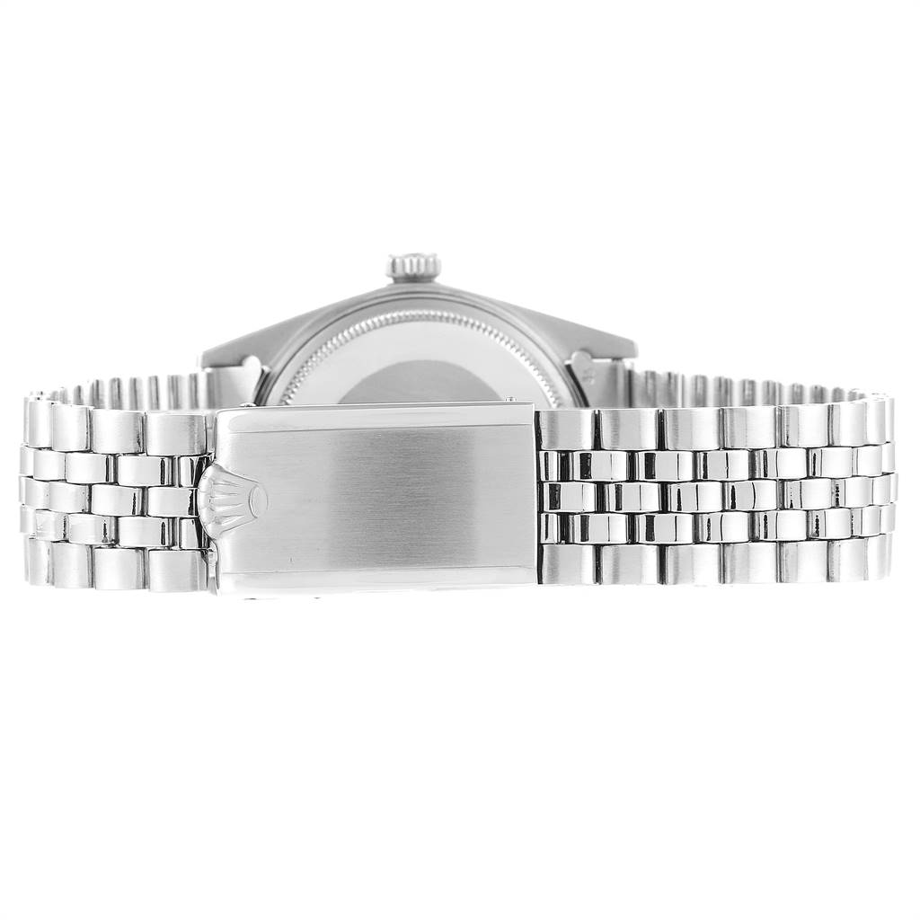 The image shows the backside and bracelet clasp of a Vintage Collection model by Rolex, highlighting the metal band and clasp.