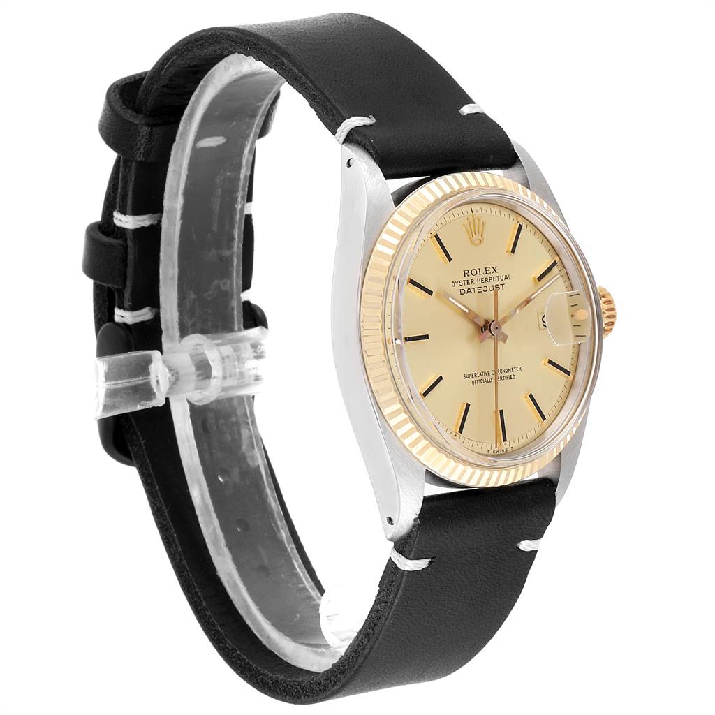 The Rolex Vintage Collection 1601 Men
s Steel and Gold (two tone) Champagne Dial 1601 Men
s Steel and Gold (two tone) Champagne Dial model watch is shown at an angle highlighting its face, bezel, and leather strap.