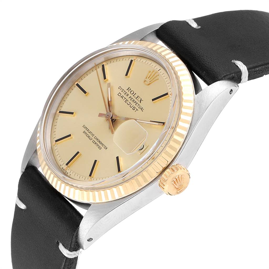 This image shows a close-up, angled view of the Rolex Vintage Collection 1601 Men
s Steel and Gold (two tone) Champagne Dial 1601 Men
s Steel and Gold (two tone) Champagne Dial Datejust, displaying its face, bezel, crown, and leather strap.