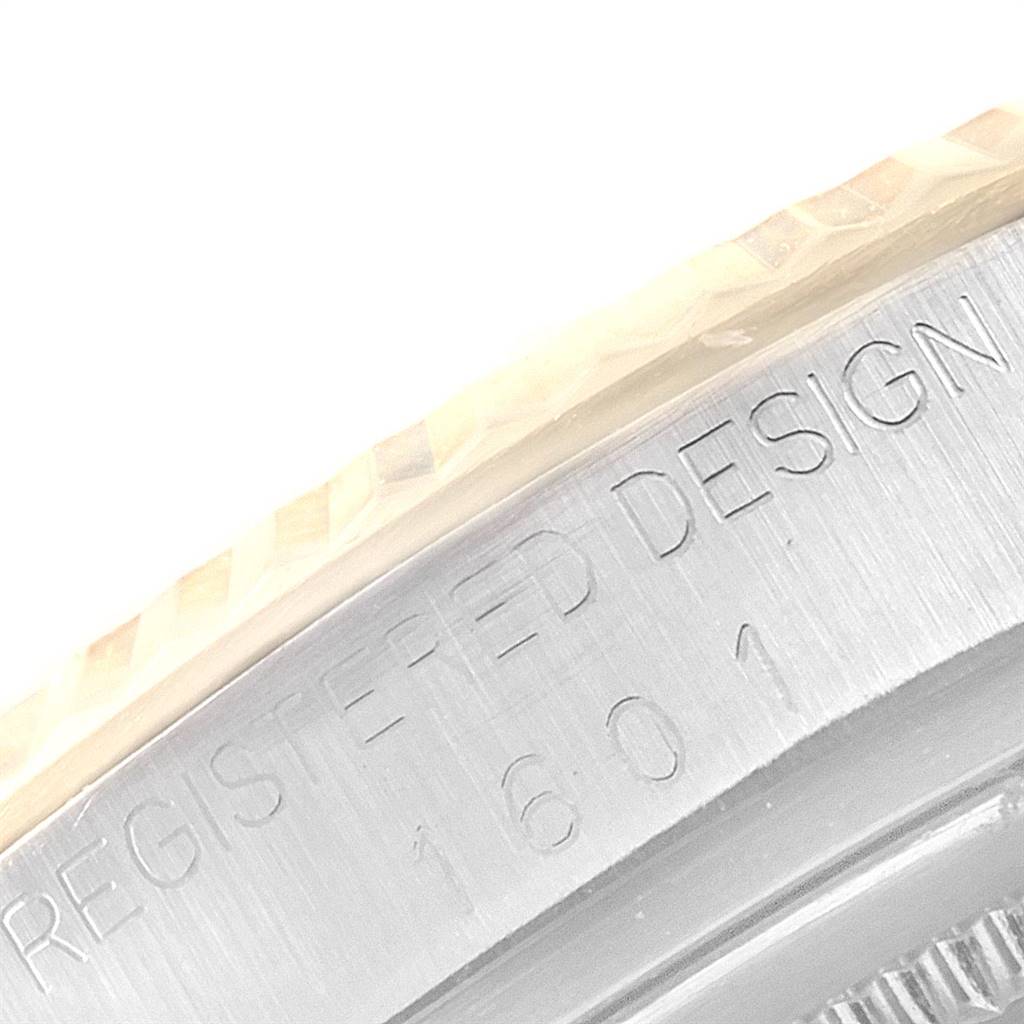 The image shows a close-up of the bezel and engraved "Registered Design 1601" on the side of the Rolex Vintage Collection 1601 Men
s Steel and Gold (two tone) Champagne Dial 1601 Men
s Steel and Gold (two tone) Champagne Dial watch.