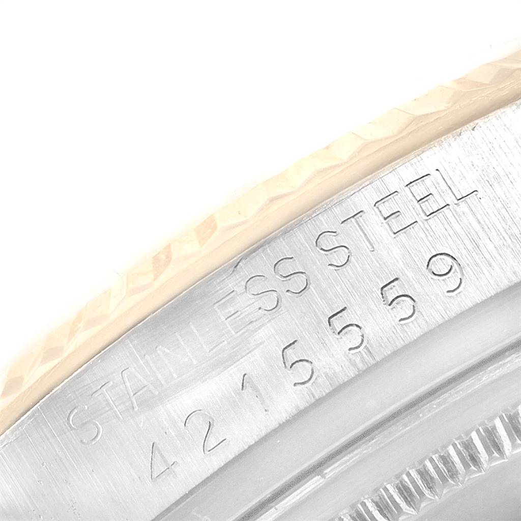 This image shows an angled close-up of the bezel and part number engraving on the Rolex Vintage Collection 1601 Men
s Steel and Gold (two tone) Champagne Dial 1601 Men
s Steel and Gold (two tone) Champagne Dial watch.
