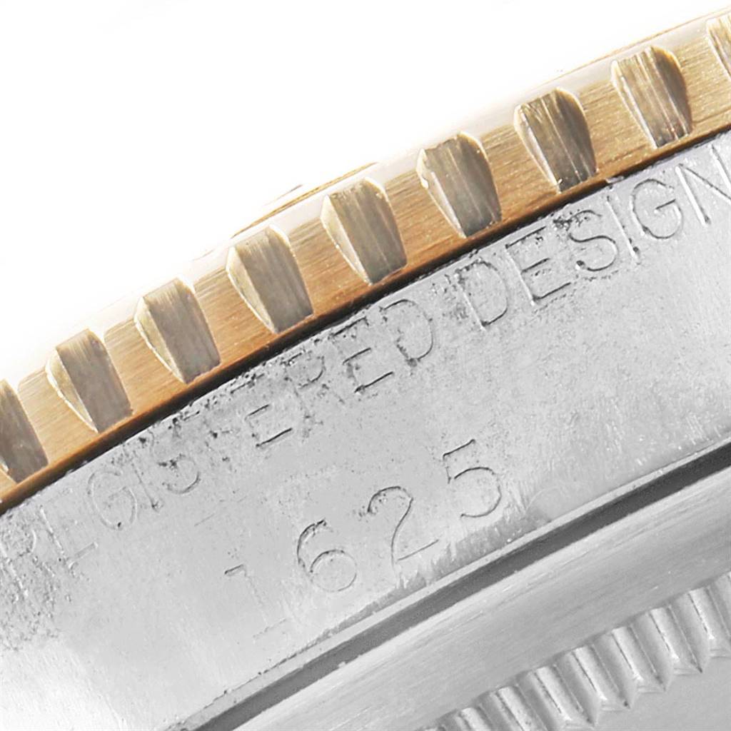 This image shows a close-up of the side of a Rolex Vintage Collection 1625 Men
s Steel and Gold (two tone) Champagne Dial 1625 Men
s Steel and Gold (two tone) Champagne Dial model, highlighting its fluted bezel and engraved model number 1625.