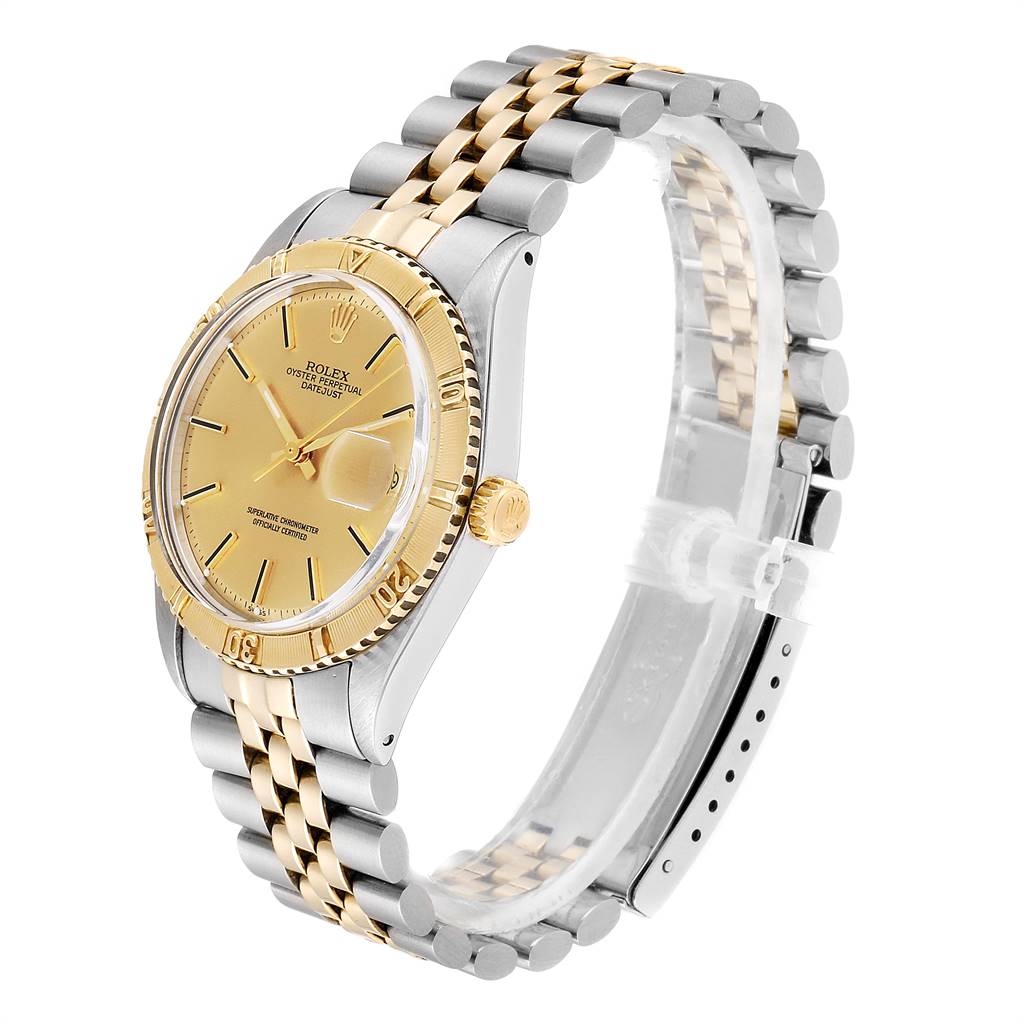 This image shows a Rolex Vintage Collection 1625 Men
s Steel and Gold (two tone) Champagne Dial 1625 Men
s Steel and Gold (two tone) Champagne Dial watch from a side angle, displaying its gold dial, bezel, and two-tone bracelet.