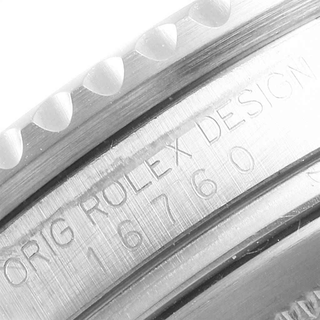 This is a close-up of the bezel and the engraved serial number on the side of a Vintage Collection Rolex watch model.