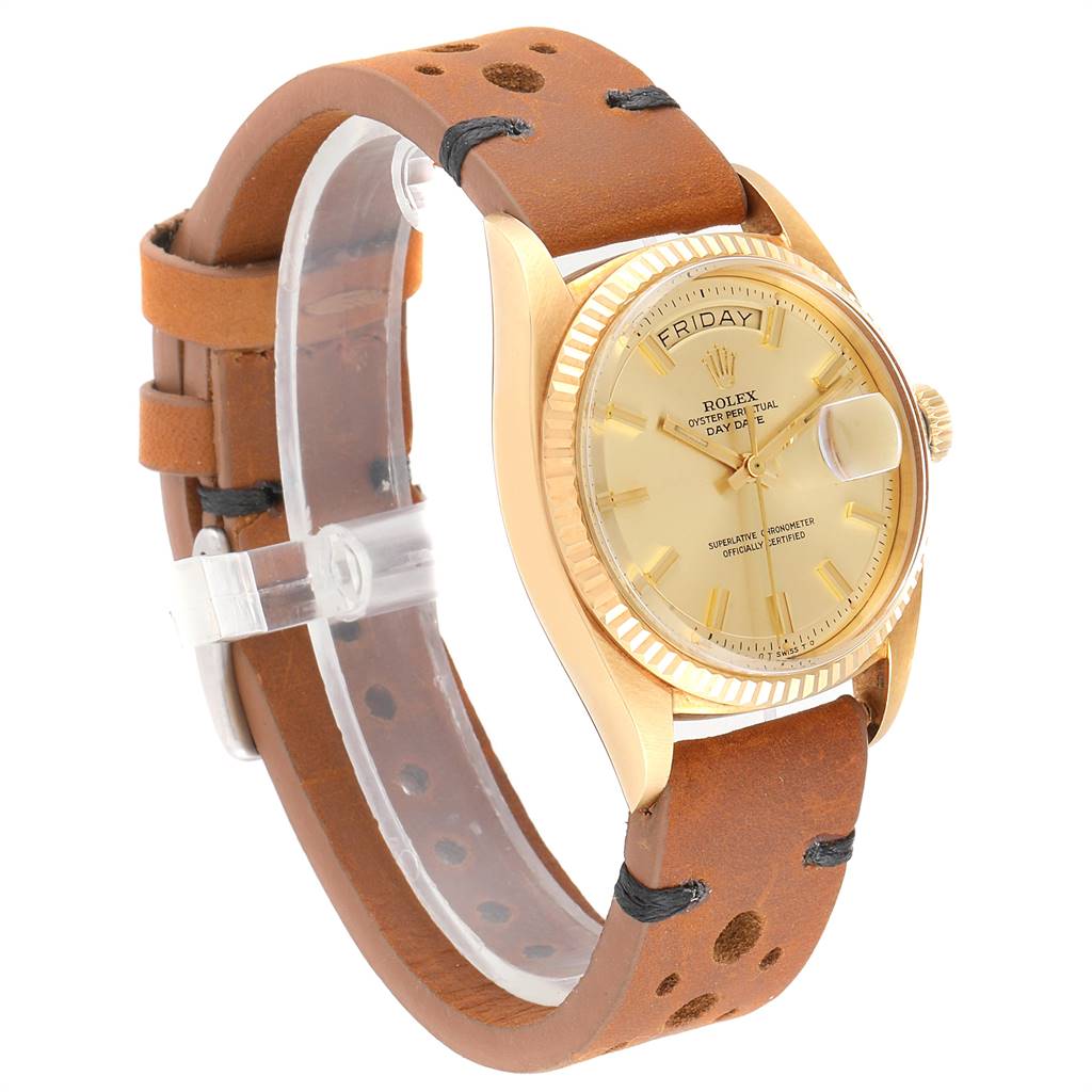 This image shows a Rolex Vintage Collection 1803 Men
s Yellow Gold Champagne Dial 1803 Men
s Yellow Gold Champagne Dial watch from a front-side angle, highlighting its bezel, dial, case, and leather strap.