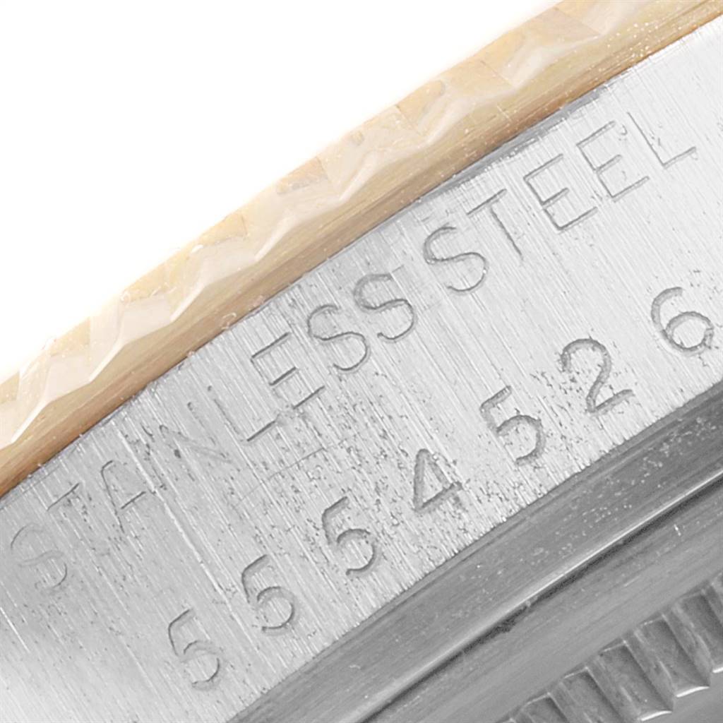 The image shows a close-up of the case side of the Vintage Collection model by Rolex, highlighting the stainless steel engraving and model number.