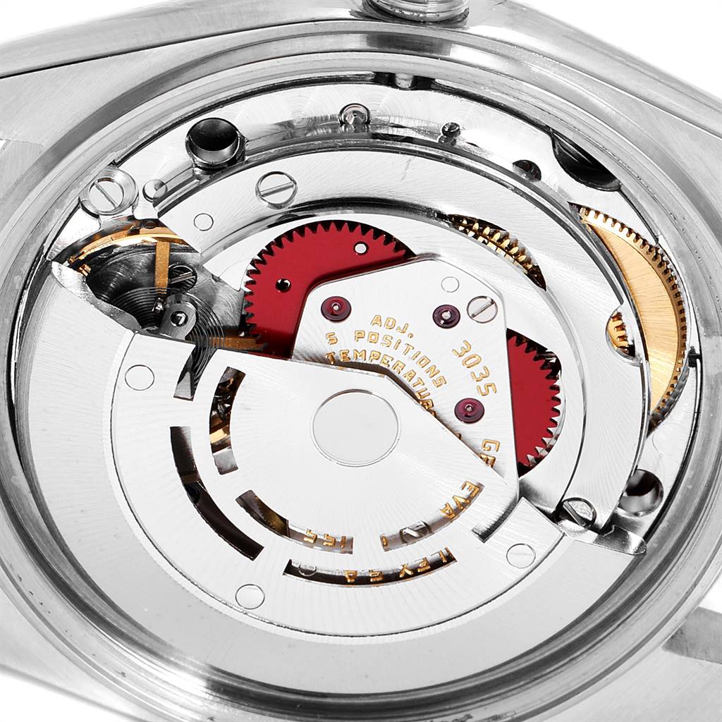 The image shows the intricate inner workings and gears of the Rolex Vintage Collection 16013 Men's Stainless Steel Champagne Dial 16013 Men's Stainless Steel Champagne Dial model, taken from the back of the watch.