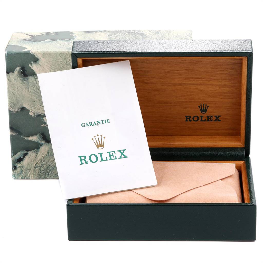 The image shows the open box and warranty booklet of a Vintage Collection model by Rolex.