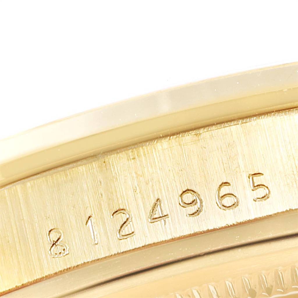 This image shows a close-up of the serial number on the side of a Rolex Vintage Collection 15505 Men
s Champagne Dial 15505 Men
s Champagne Dial model.