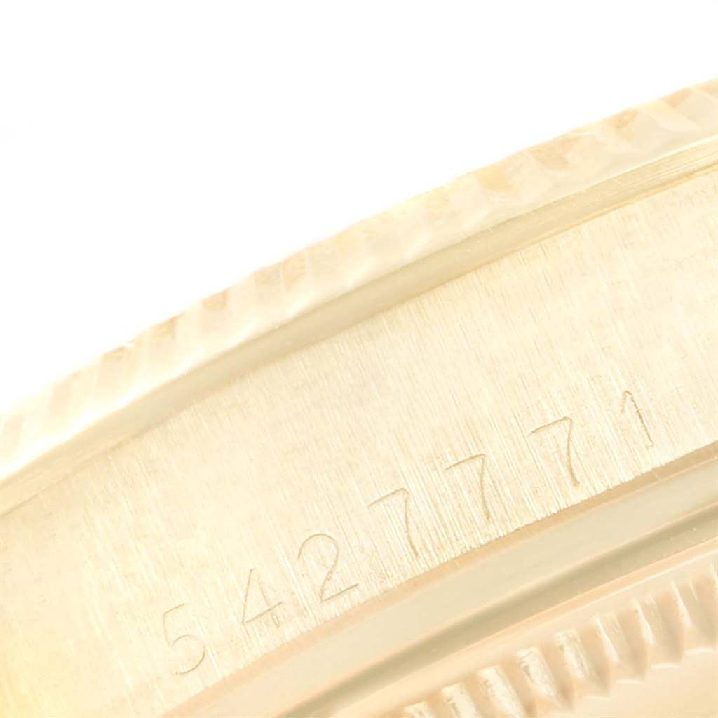 This image shows a close-up of the side of the Rolex Vintage Collection 1503 Men
s Yellow Gold Silver Dial 1503 Men
s Yellow Gold Silver Dial watch case, displaying the serial number engraving.