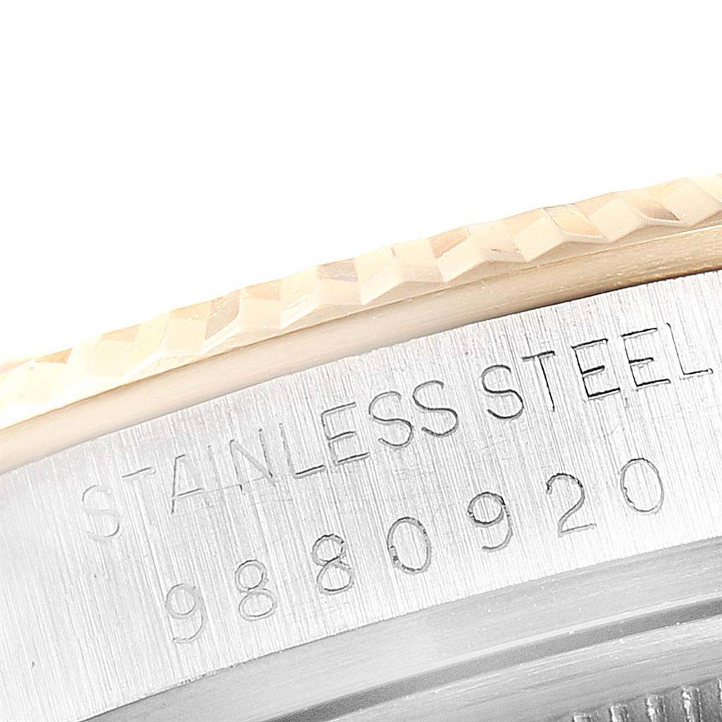 The image shows a close-up angle of the serial number and "stainless steel" engraving on the case edge of a Rolex Vintage Collection 16013 Men's Stainless Steel Champagne Dial 16013 Men's Stainless Steel Champagne Dial watch.